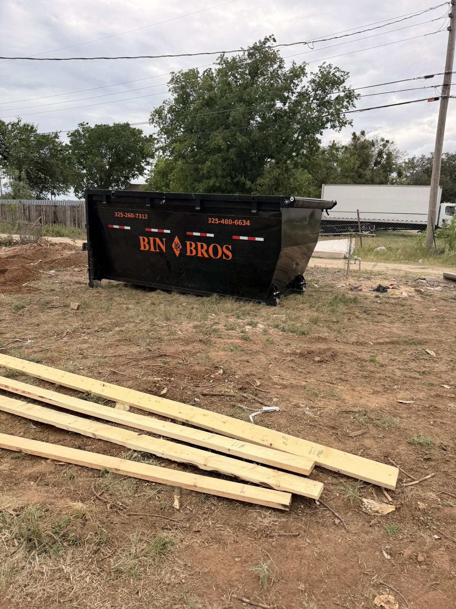 Bin Bros roll-off dumpster placed at a property project