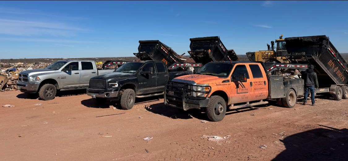 Bin Bros trucks and roll-off containers lined up