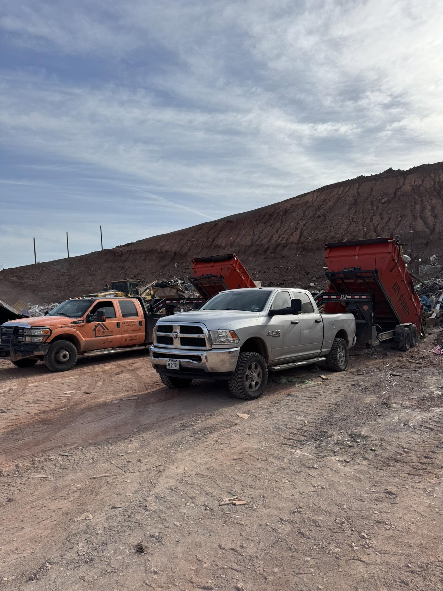 Bin Bros trucks and containers working at a debris site