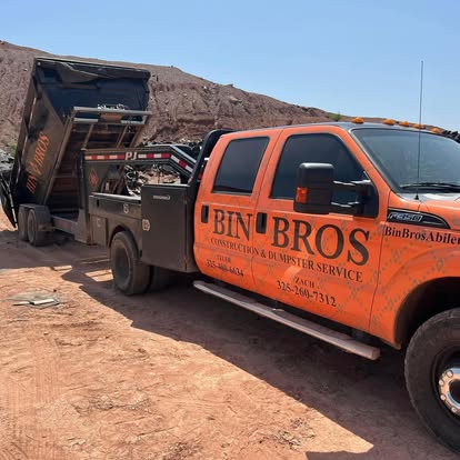 Bin Bros roll-off truck carrying a container